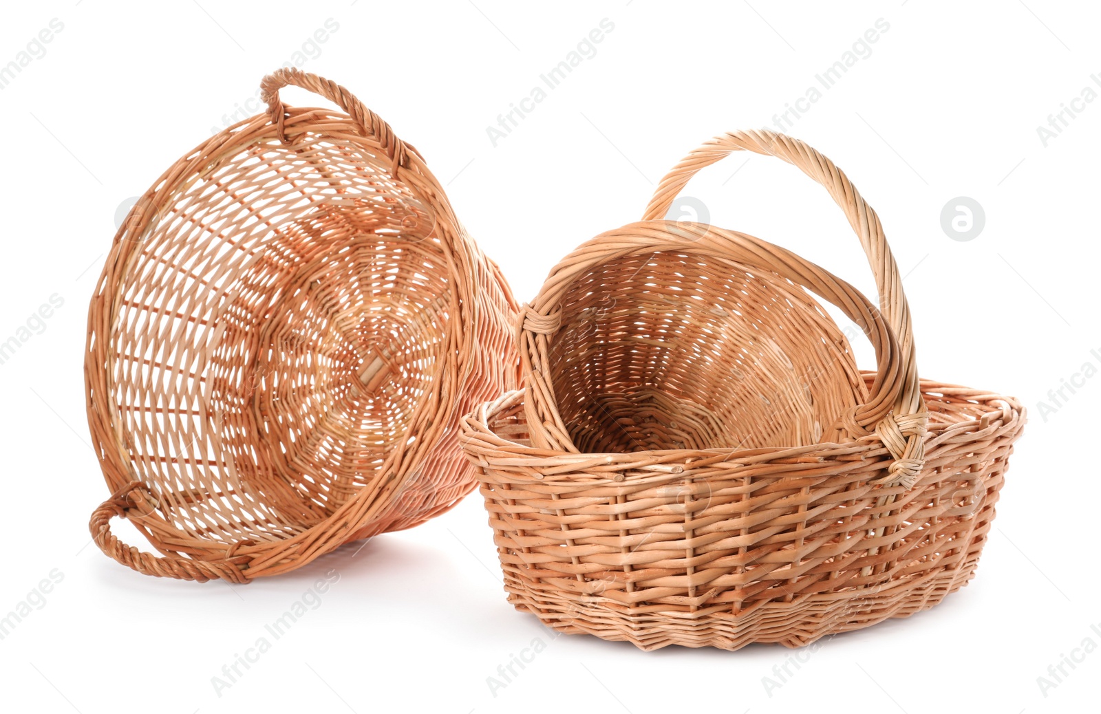 Photo of Three decorative wicker baskets on white background