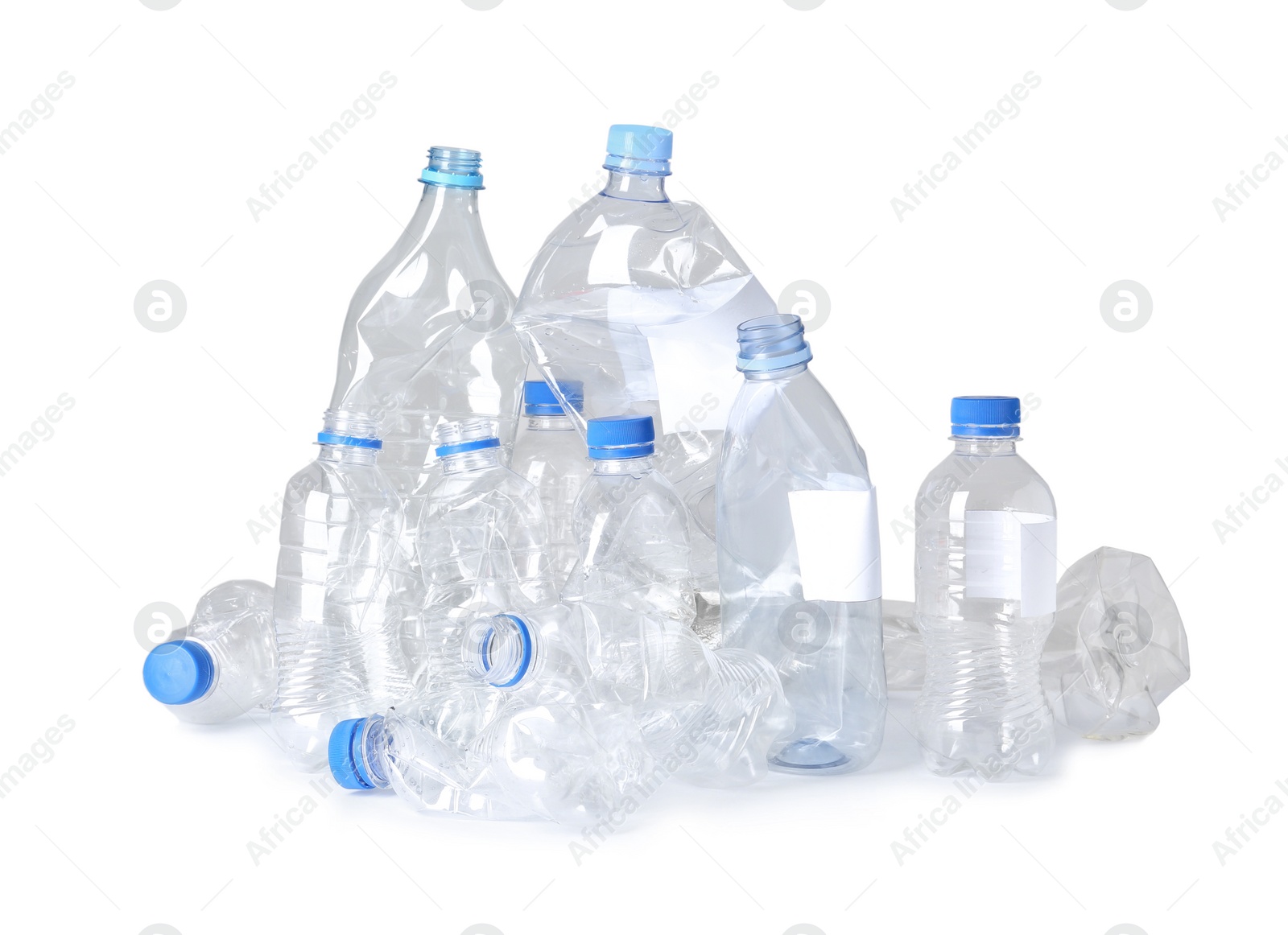 Photo of Crumpled plastic bottles on white background. Recycling problem