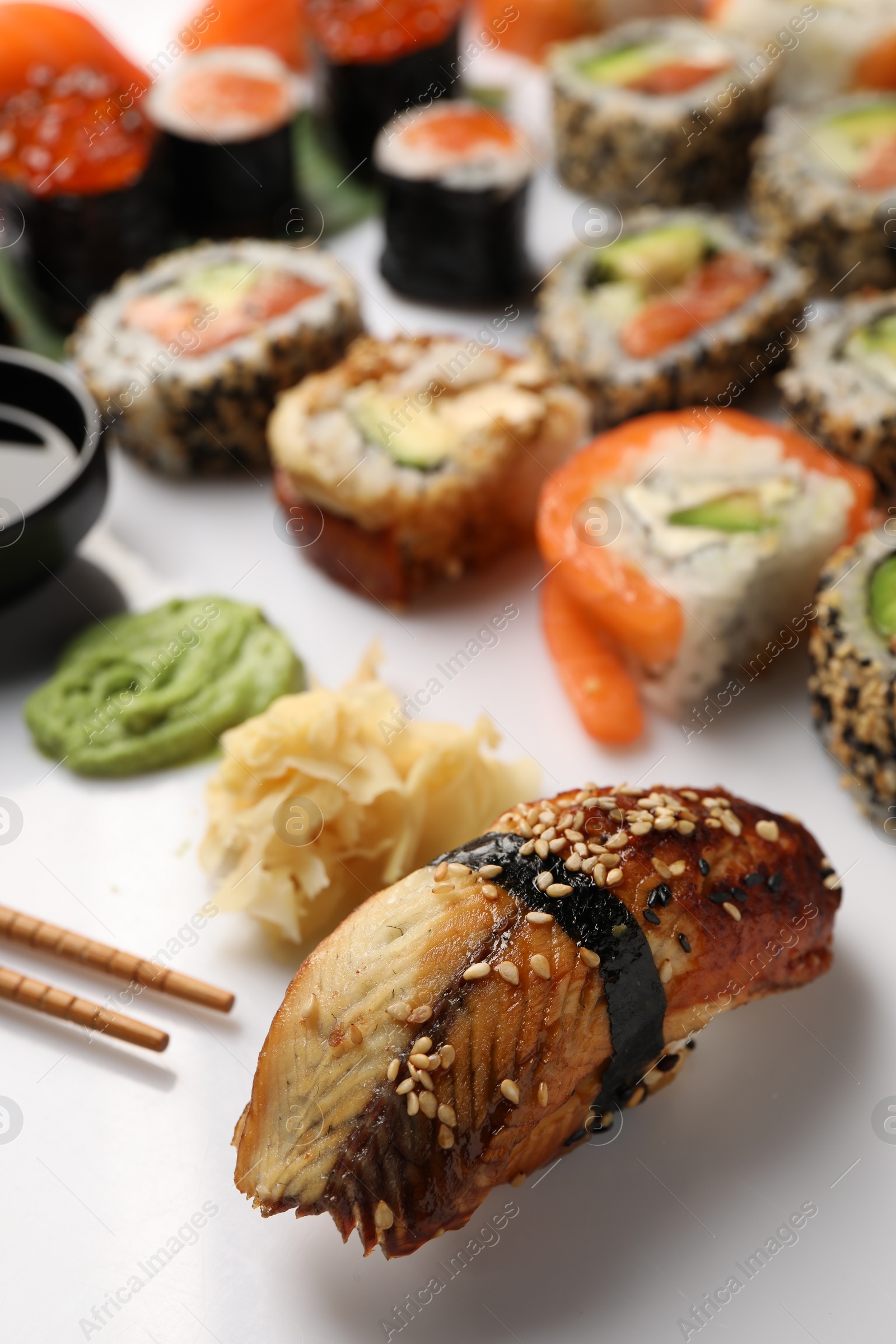 Photo of Set of delicious sushi rolls on white background, closeup