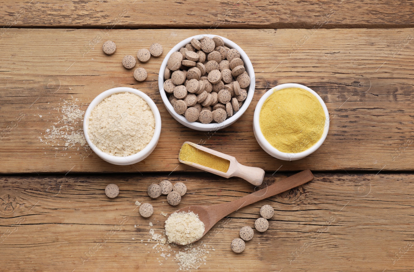 Photo of Flat lay composition with different types of brewer`s yeast on wooden table