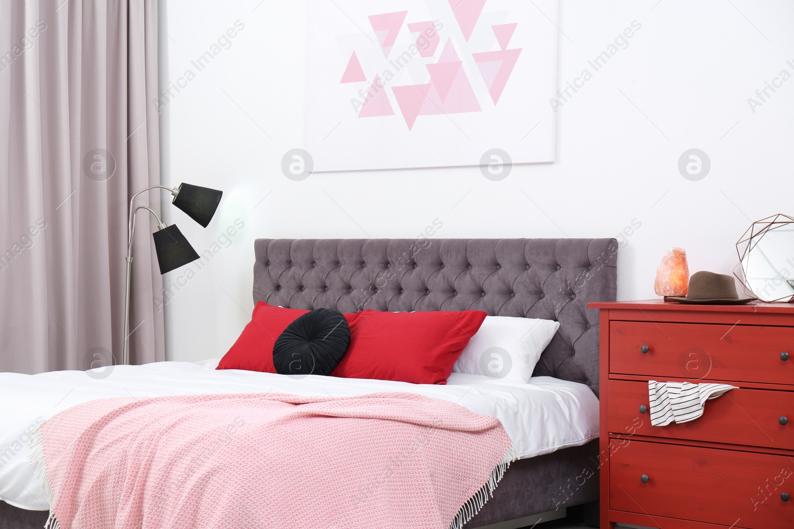 Photo of Stylish room interior with large comfortable bed