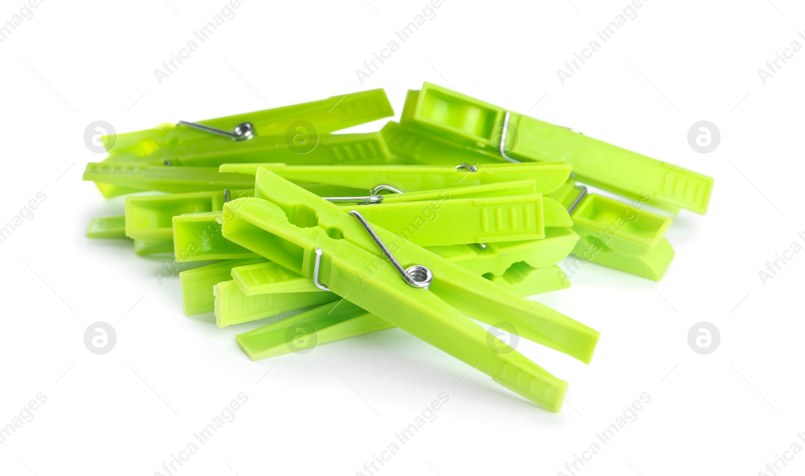 Photo of Bright green plastic clothespins on white background