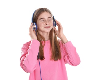 Teenage girl enjoying music in headphones on white background