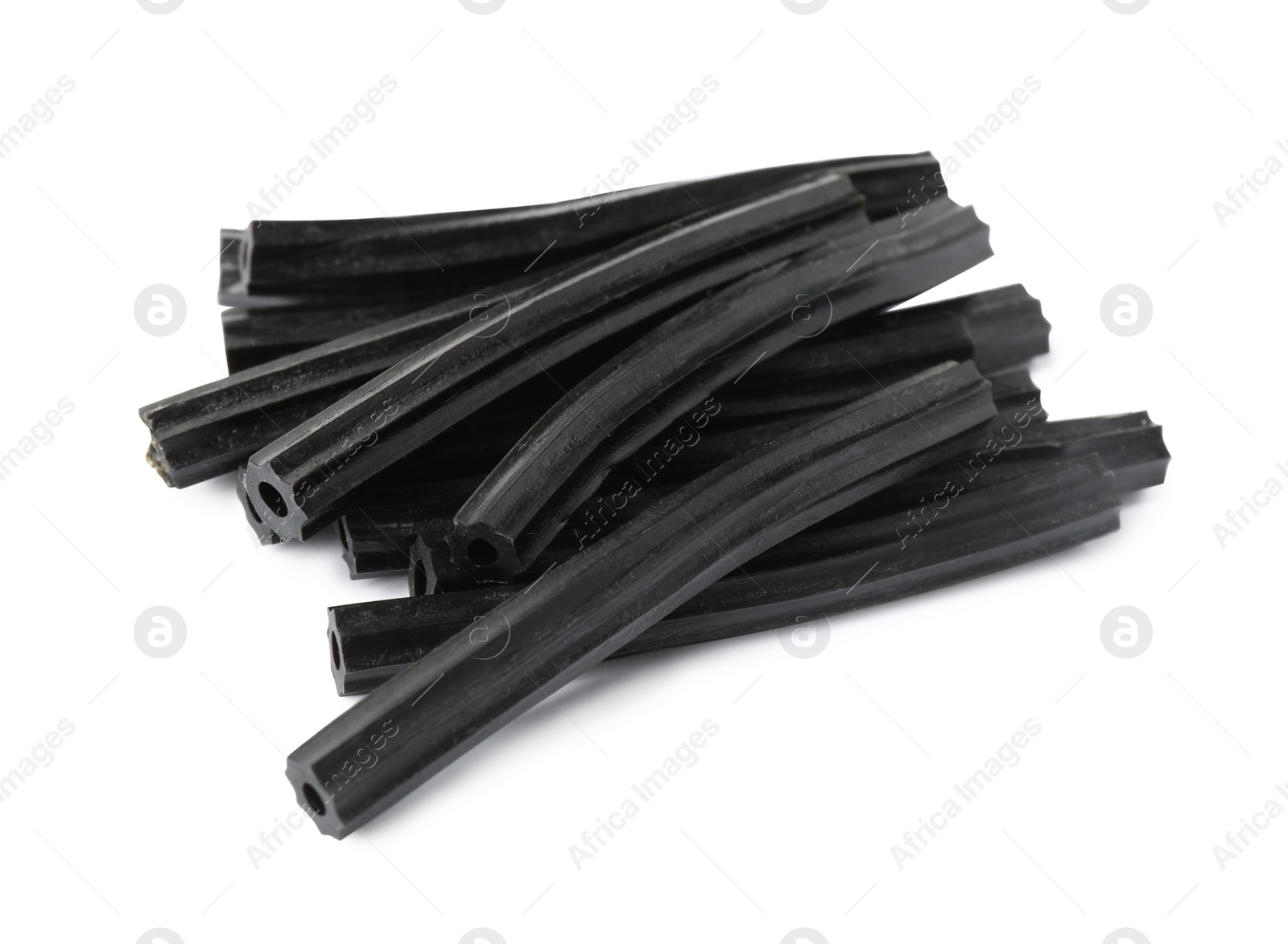 Photo of Tasty black liquorice candies on white background