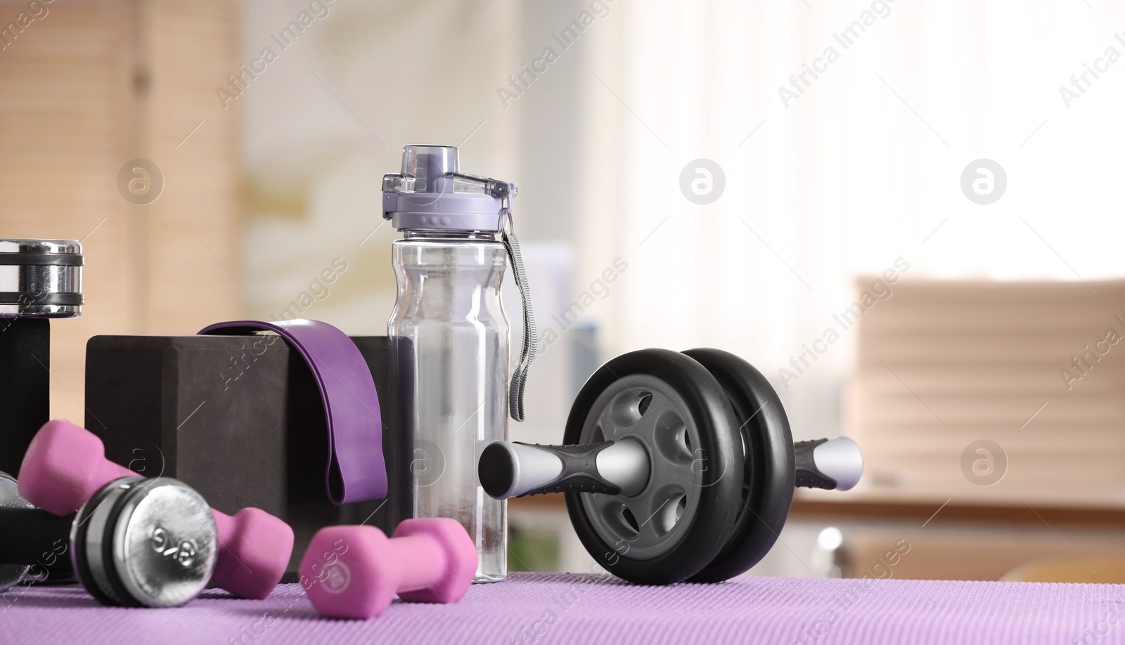 Photo of Many different sports equipment on mat indoors, banner design