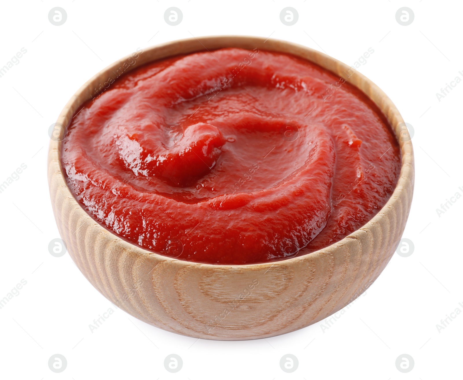 Photo of Tasty ketchup in wooden bowl isolated on white, closeup