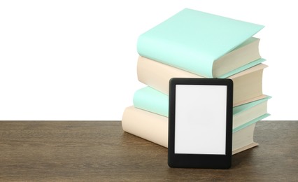 Stack of hardcover books and modern e-book on wooden table against white background. Space for text