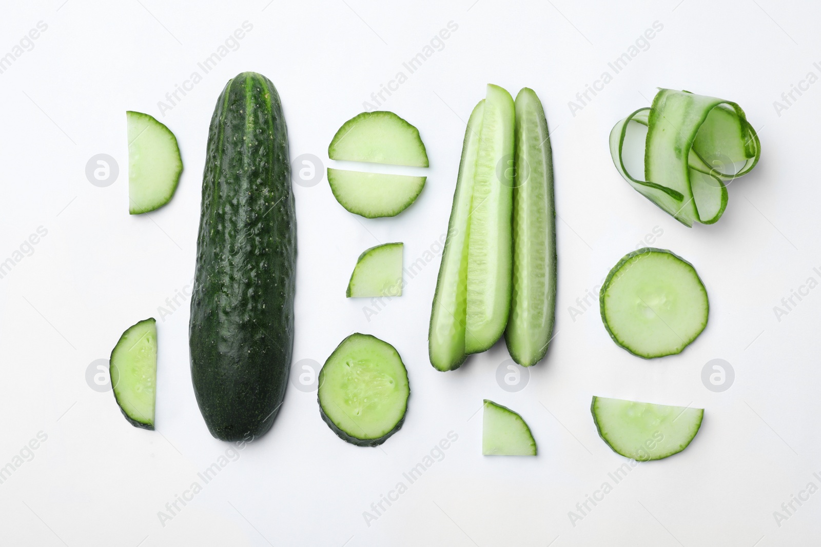 Photo of Flat lay composition with slices of cucumber on white background