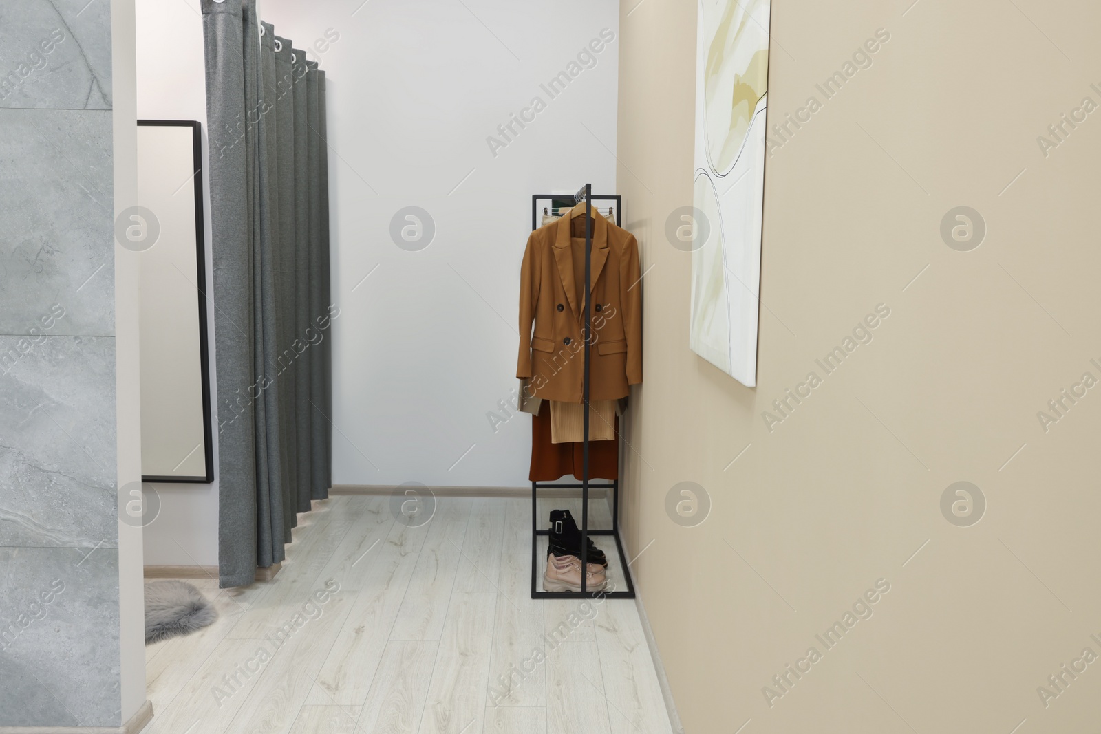 Photo of Dressing rooms in fashion store. Interior design