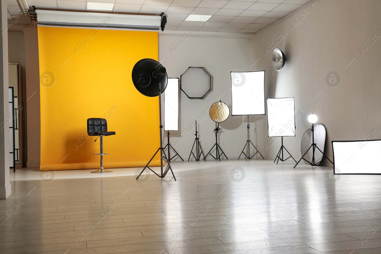 Photo of Interior of modern photo studio with professional equipment