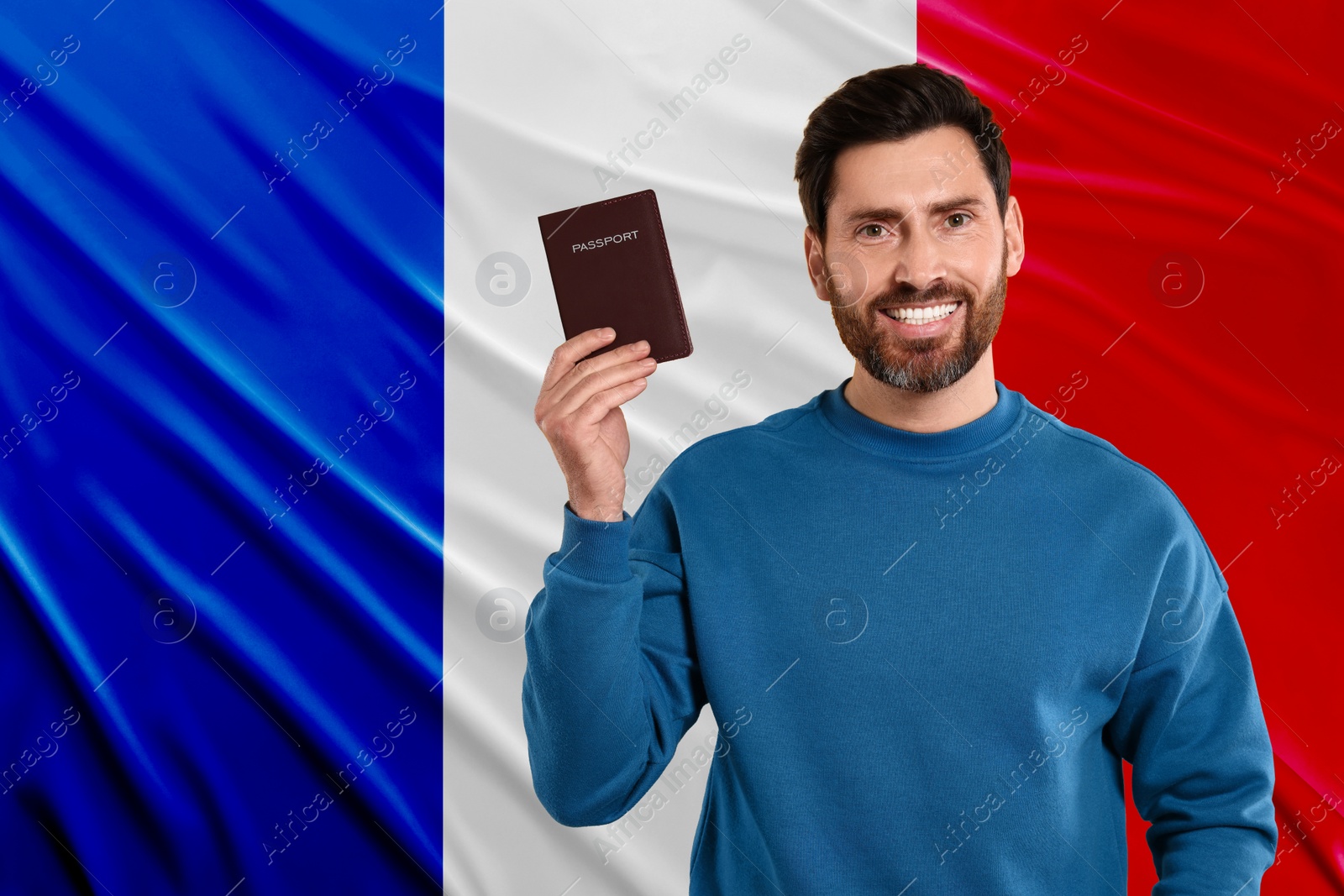 Image of Immigration. Happy man with passport against national flag of France, space for text