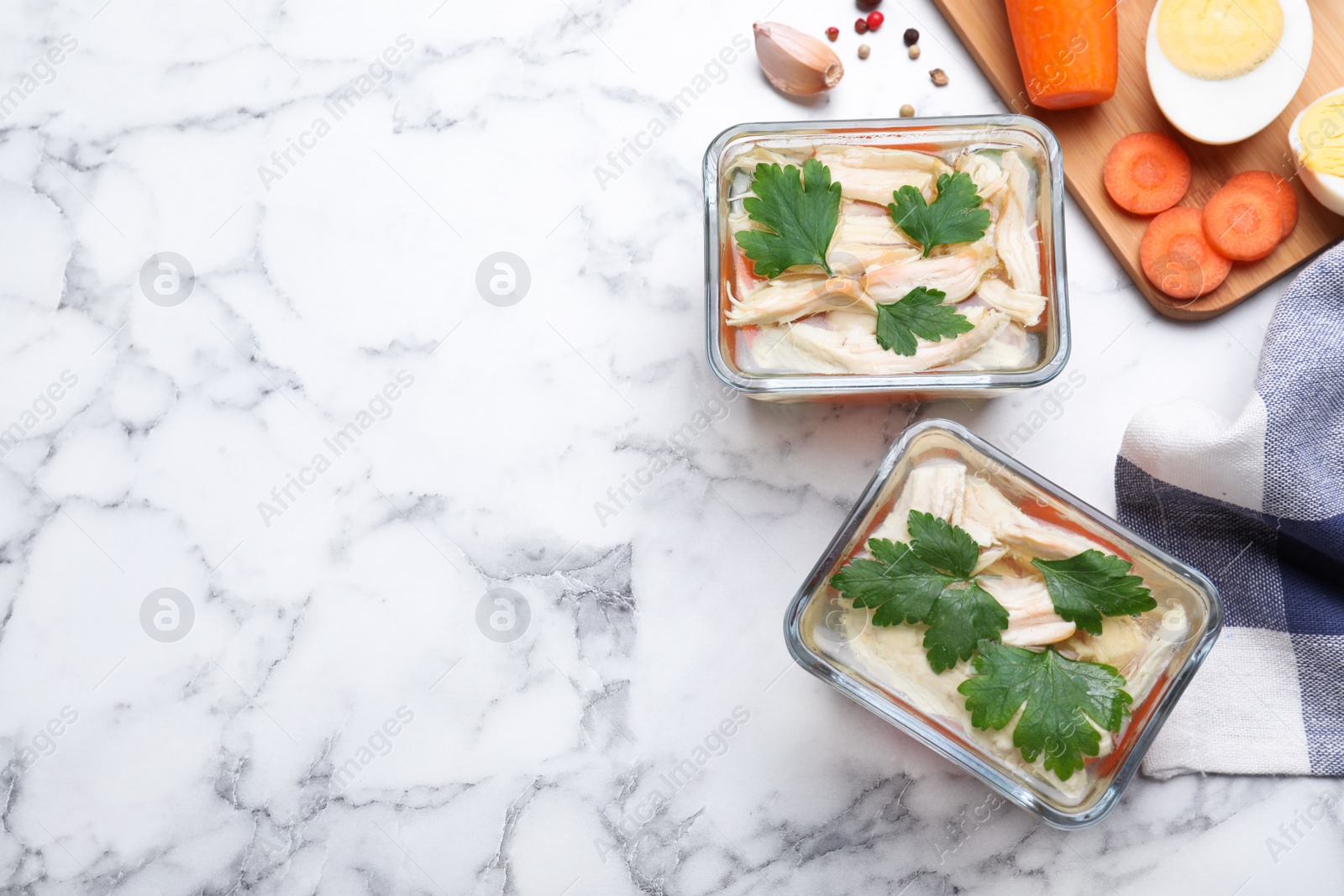 Photo of Delicious chicken aspic served on white marble table, flat lay. Space for text