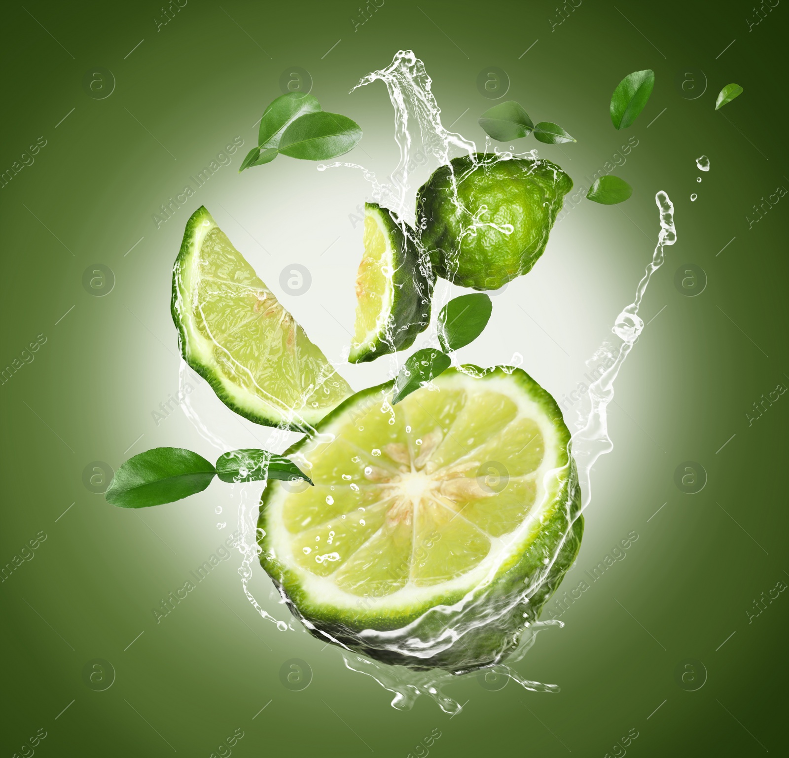 Image of Fresh ripe bergamot fruits, green leaves and splashing water on color background