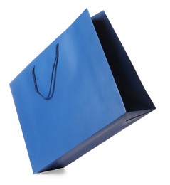 Photo of One blue shopping bag isolated on white