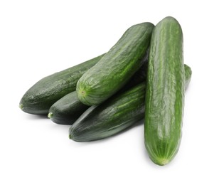Photo of Many long fresh cucumbers isolated on white