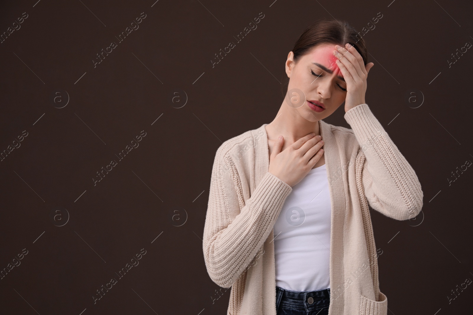 Image of Woman suffering from headache on brown background, space for text. Cold symptoms