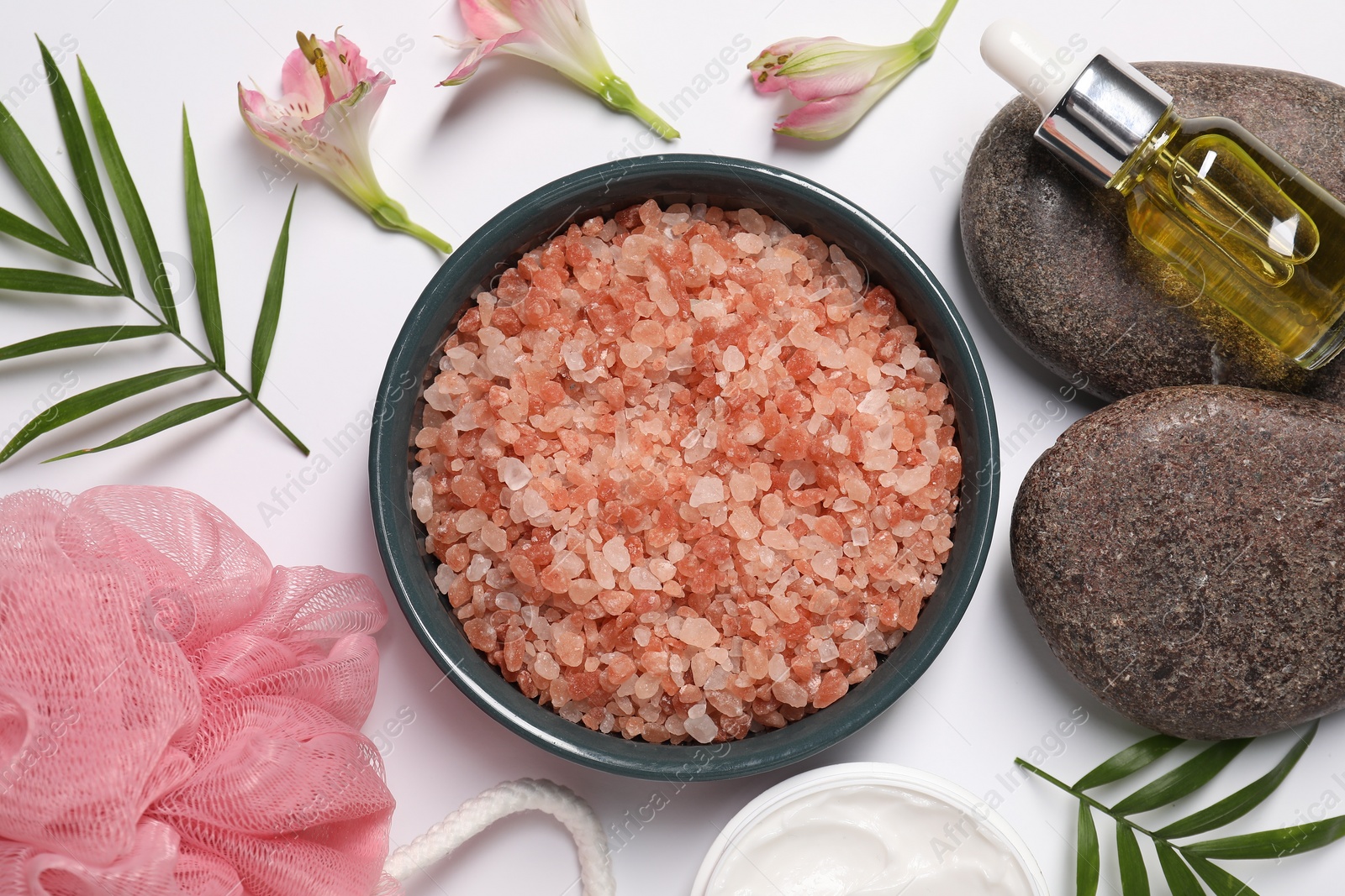 Photo of Flat lay composition with natural sea salt on white background