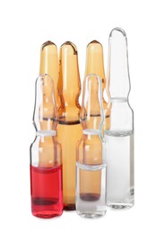 Different ampoules with pharmaceutical products on white background