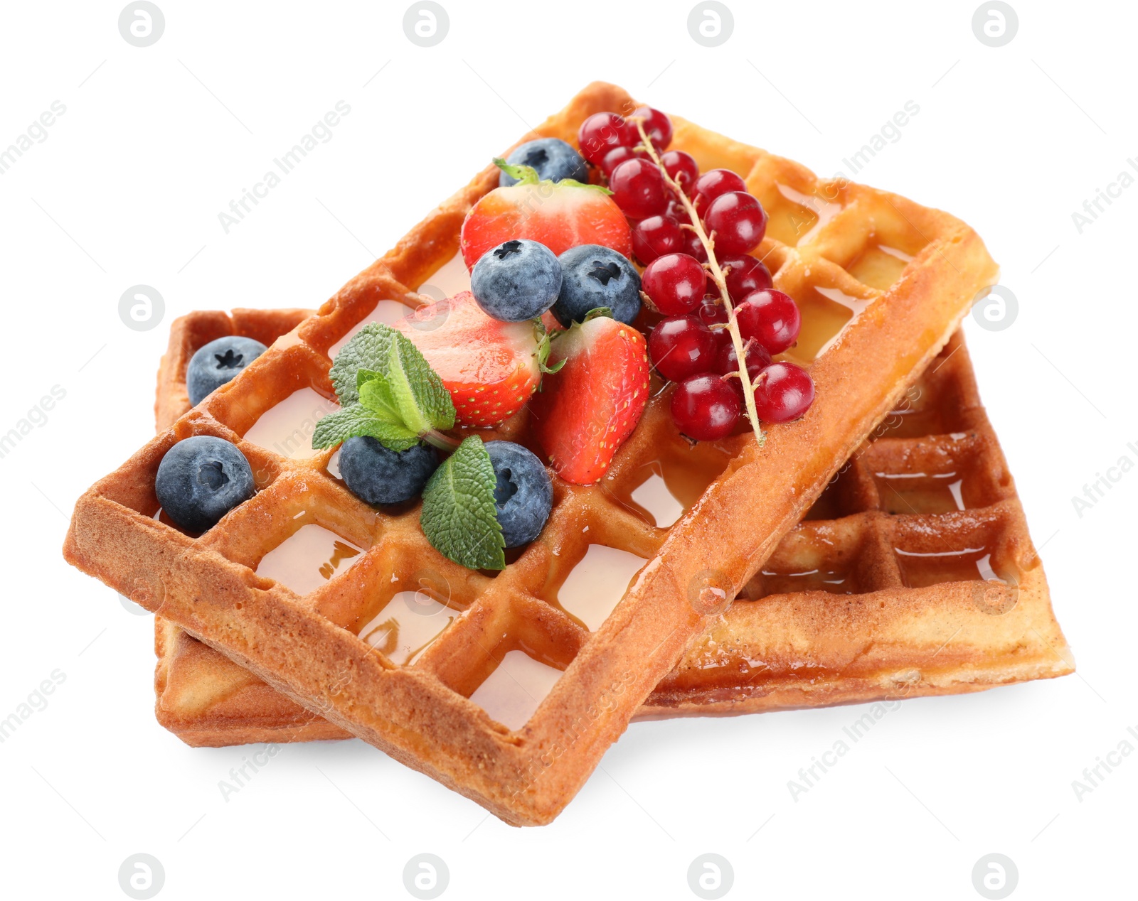 Photo of Delicious Belgian waffles with berries on white background