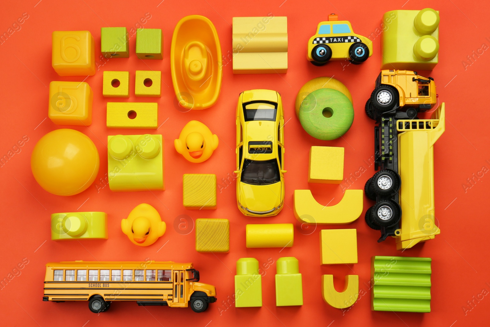 Photo of Different children's toys on orange background, flat lay