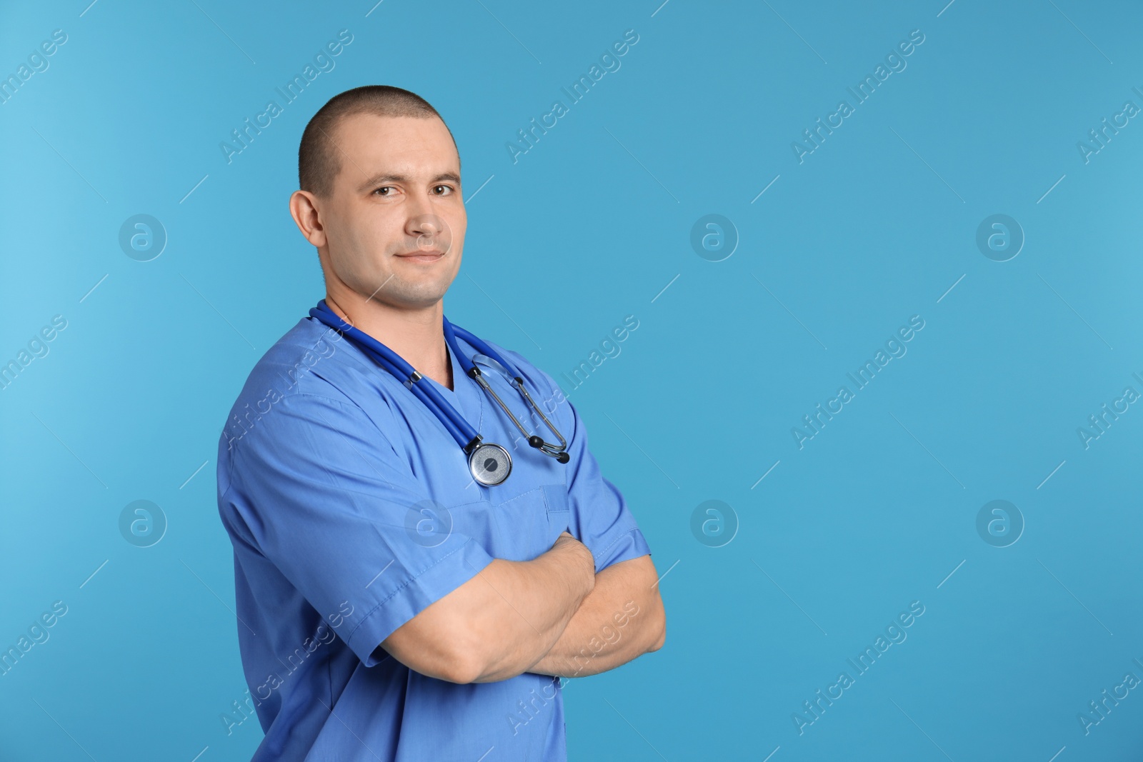 Photo of Portrait of medical assistant with stethoscope on color background. Space for text