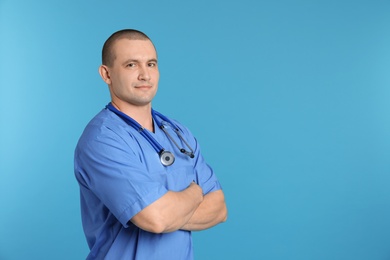 Photo of Portrait of medical assistant with stethoscope on color background. Space for text