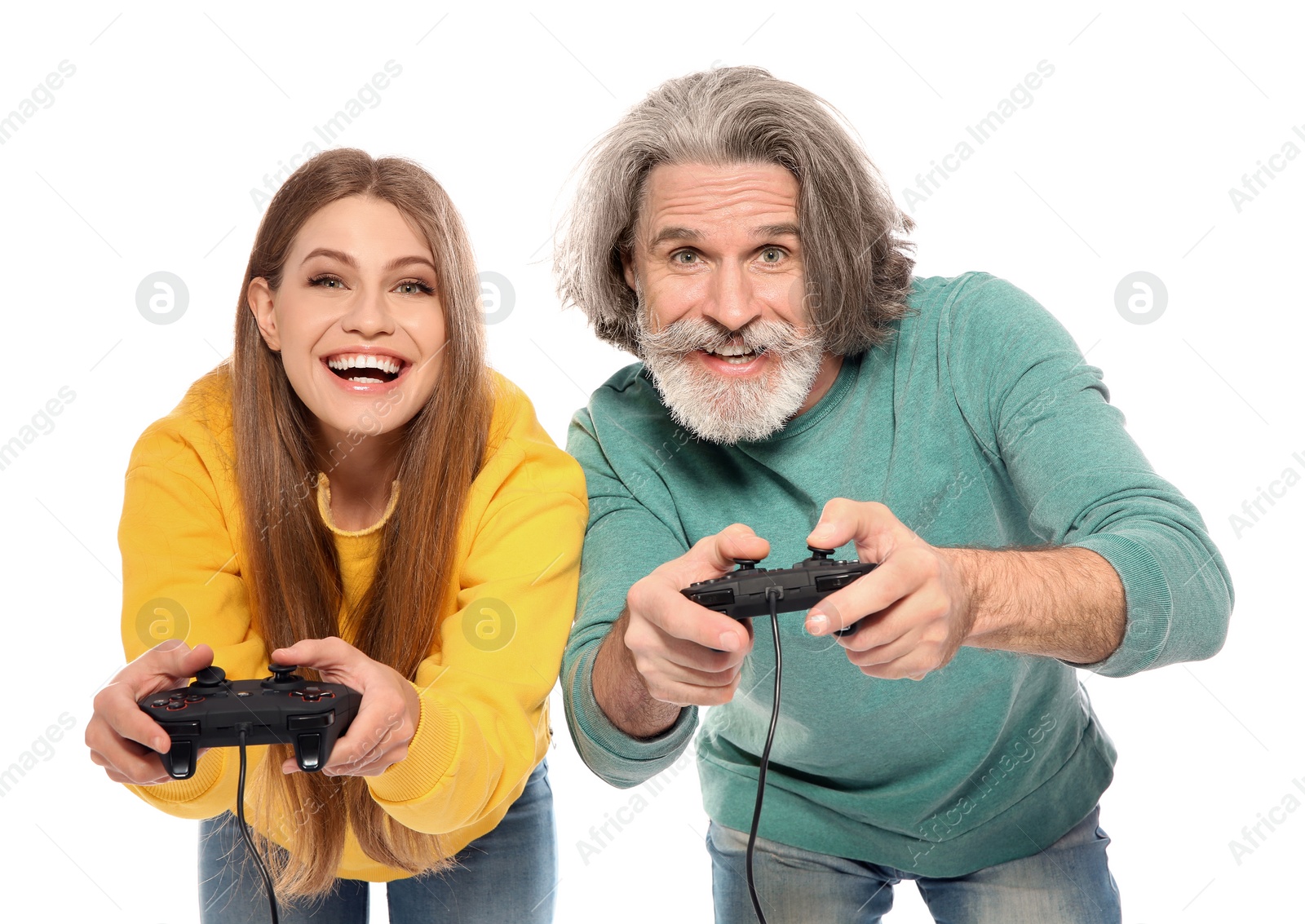 Photo of Mature man and young woman playing video games with controllers isolated on white