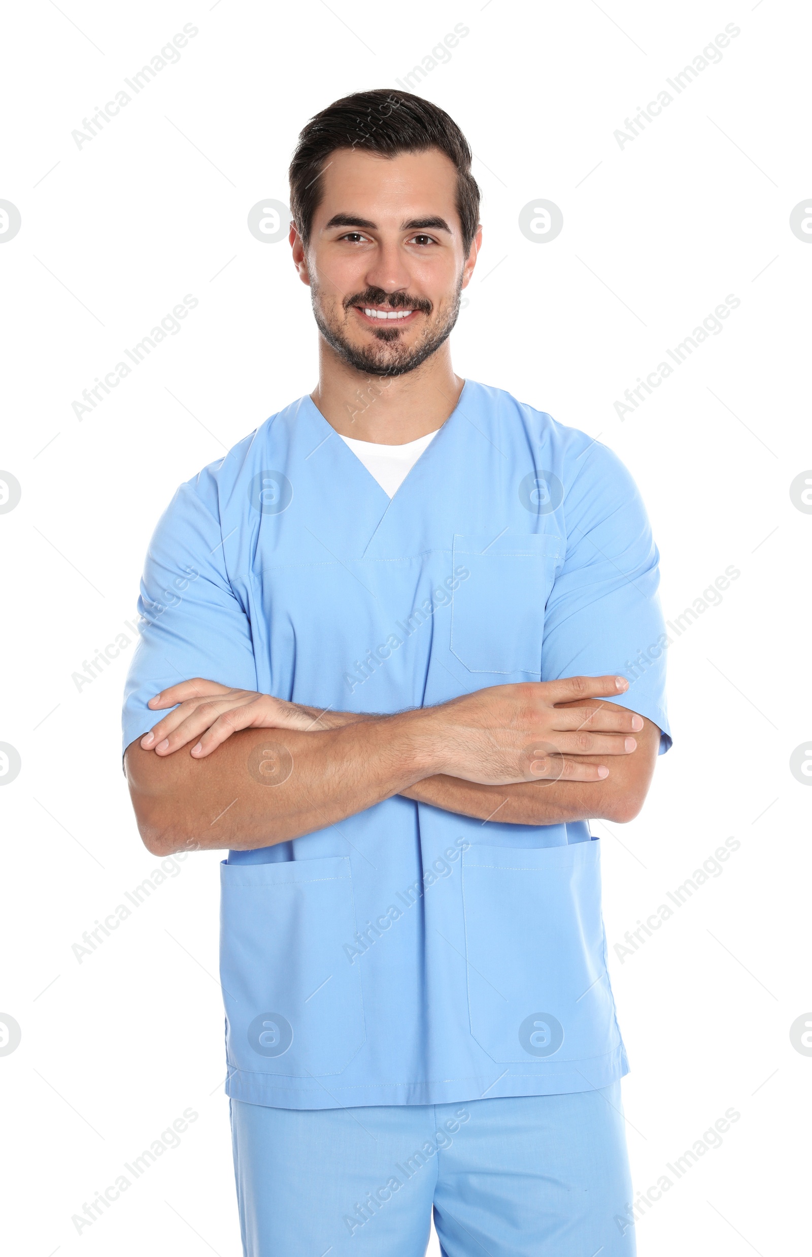 Photo of Portrait of young male doctor in uniform on white background. Medical service