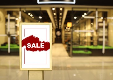Image of Advertising board with text SALE in shopping mall. Special promotion