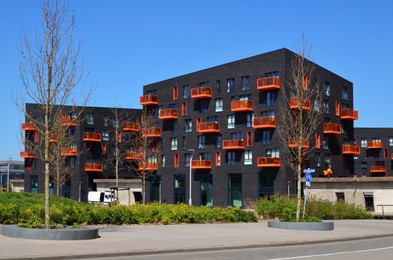 Photo of Exterior of beautiful modern residential complex on sunny day