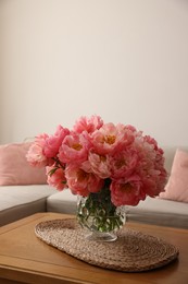 Photo of Beautiful pink peonies in vase on table at home, space for text. Interior design