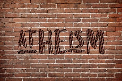 Image of Word Atheism on brick wall. Philosophical or religious position