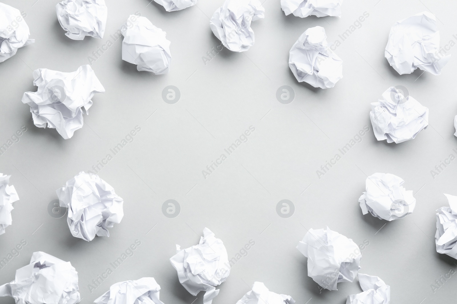 Photo of Crumpled sheets of paper on light background, flat lay. Space for text