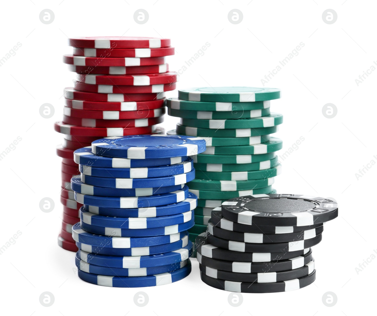 Photo of Plastic casino chips stacked on white background. Poker game