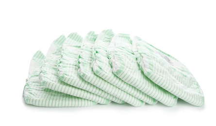 Photo of Pile of disposable diapers on white background. Baby accessories