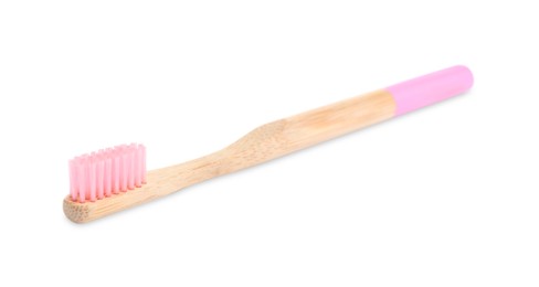 Bamboo toothbrush with pink bristle isolated on white