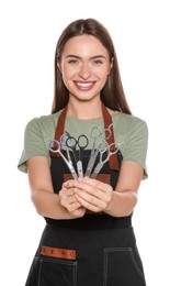 Portrait of happy hairdresser with professional scissors on white background