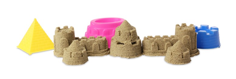 Beautiful sand castle and plastic molds isolated on white. Outdoor play