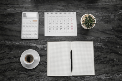 Photo of Flat lay composition with calendar on grey marble table