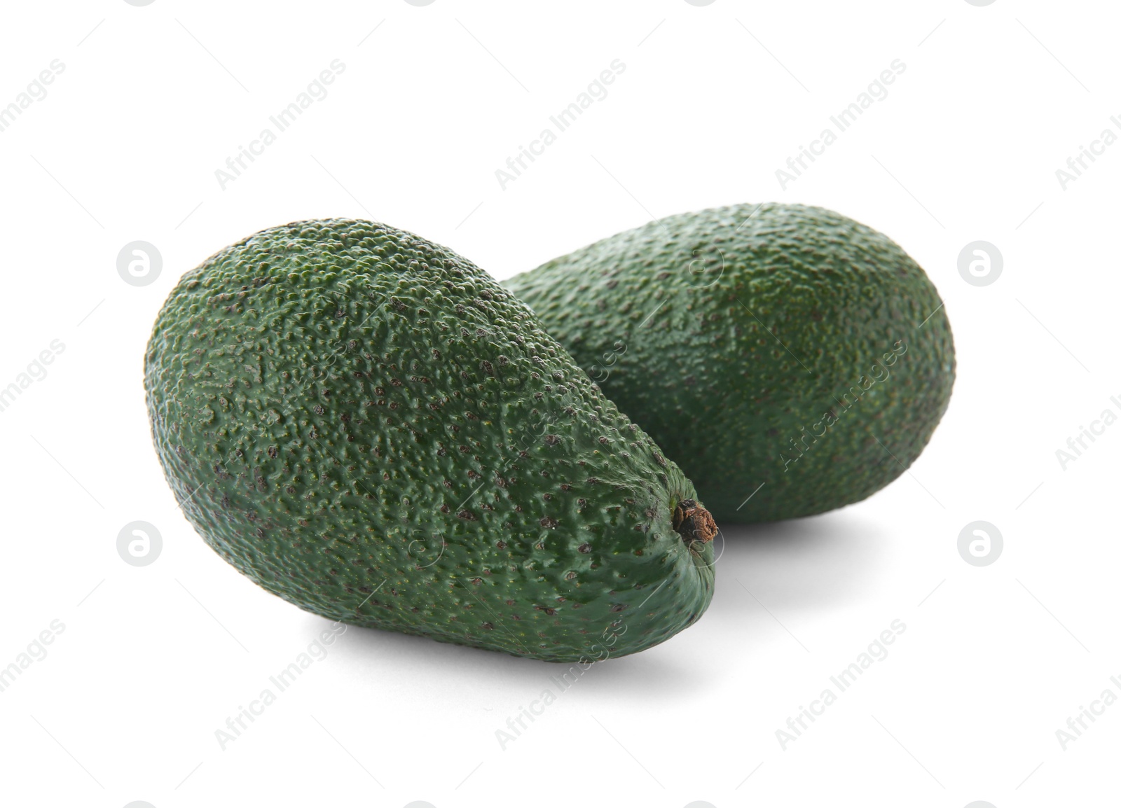 Photo of Ripe avocados on white background. Tropical fruit