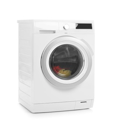 Modern washing machine with laundry on white background