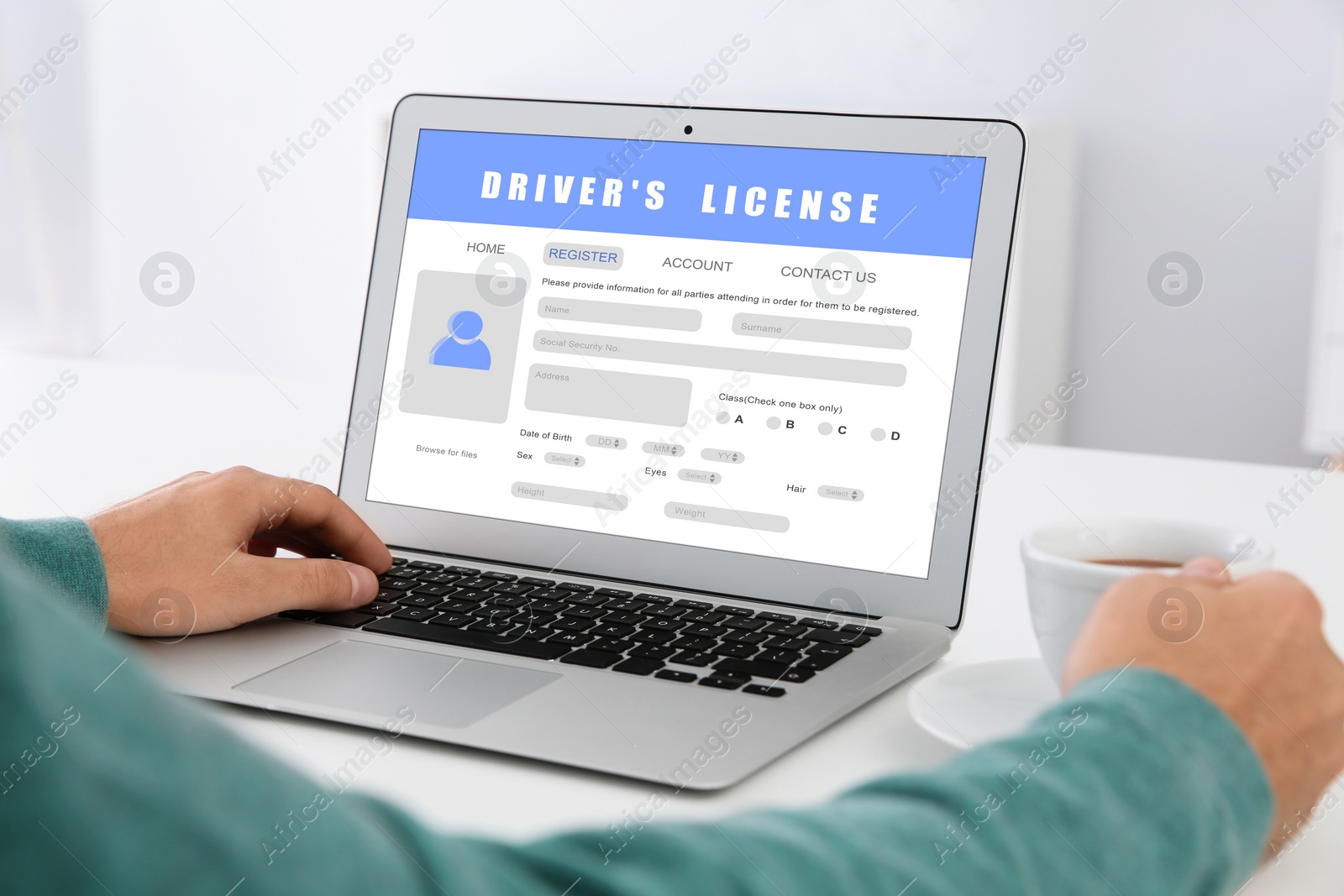 Image of Man filling in driver's license form online on website using laptop, closeup