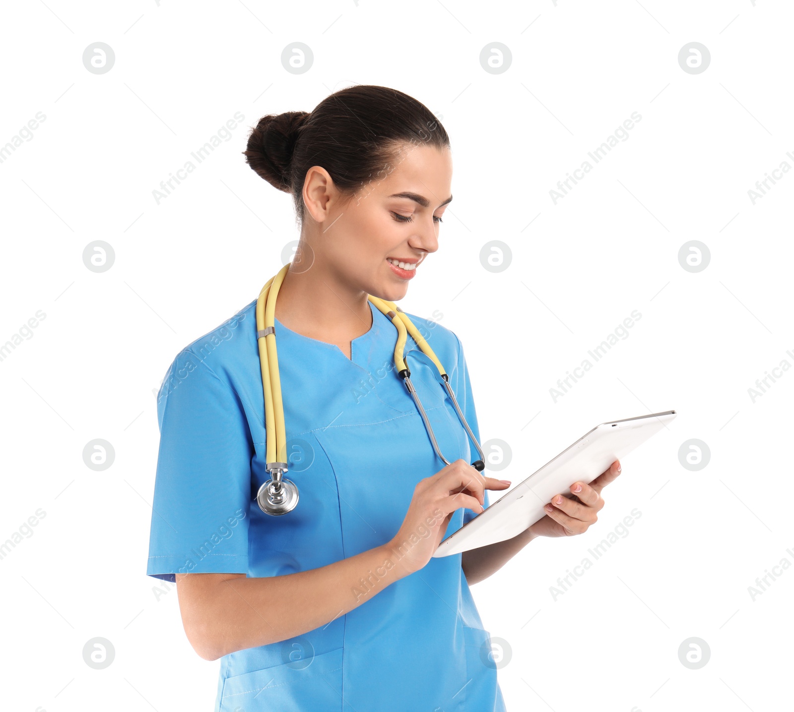 Photo of Portrait of young medical assistant with stethoscope and tablet on white background