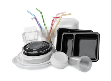 Photo of Pile of different plastic items on white background