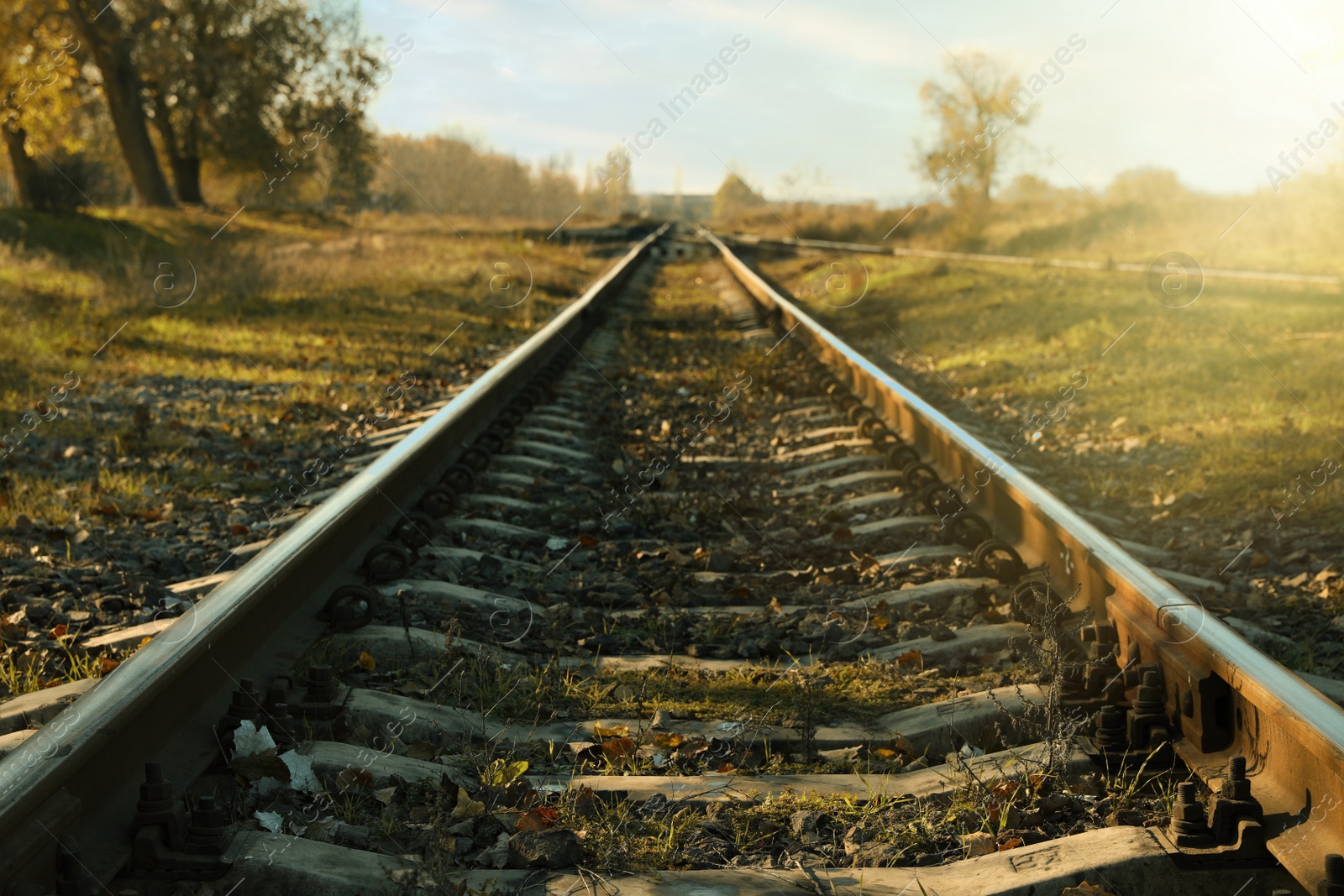 Photo of Railway line in countryside on sunny day. Train journey