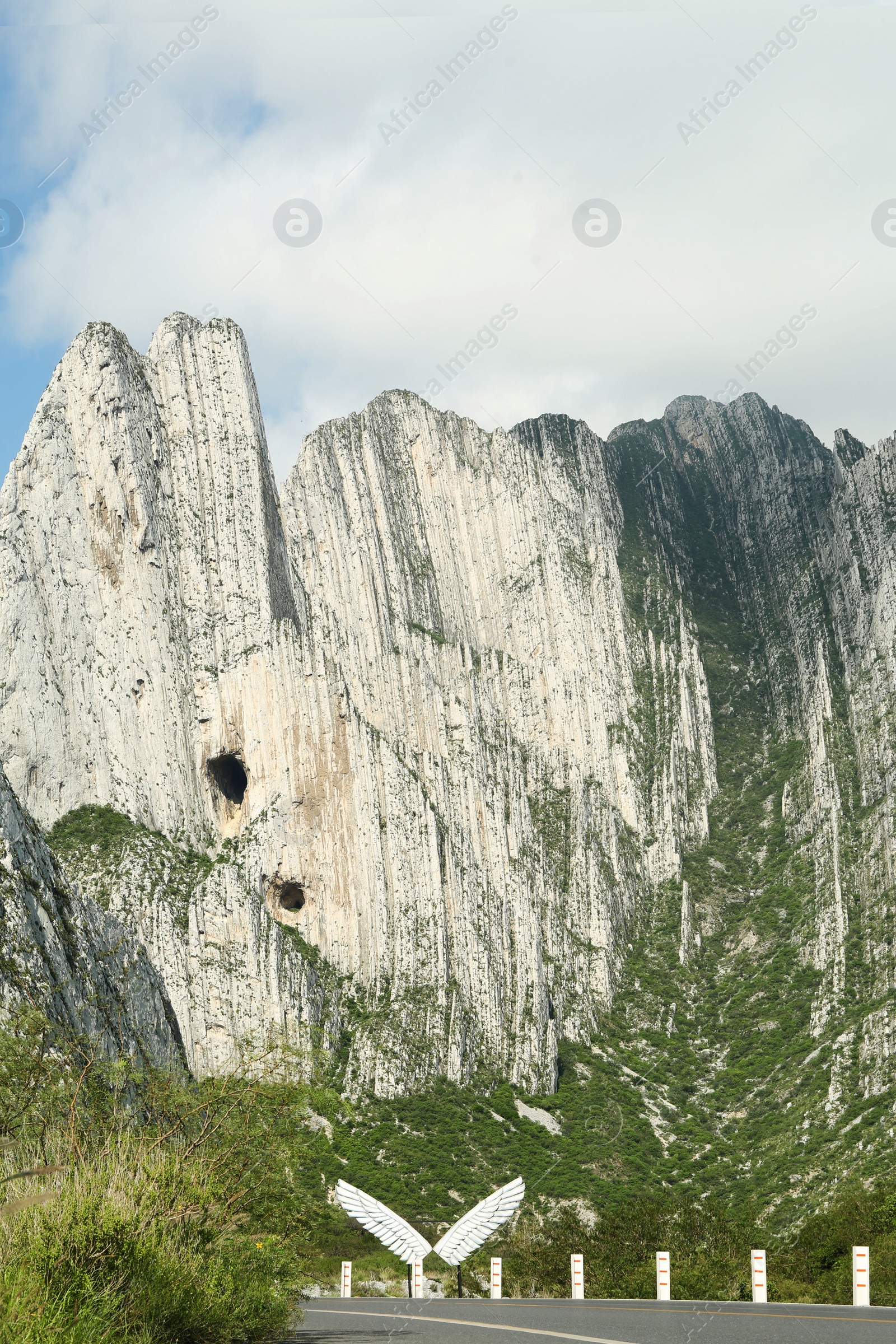 Photo of Picturesque view of big mountains near road