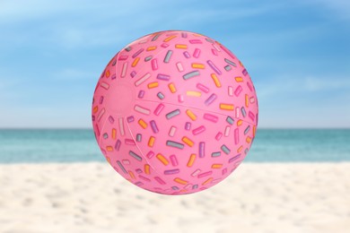 Image of Bright inflatable beach ball and seascape on background