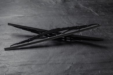 Photo of Car windshield wipers on black slate background