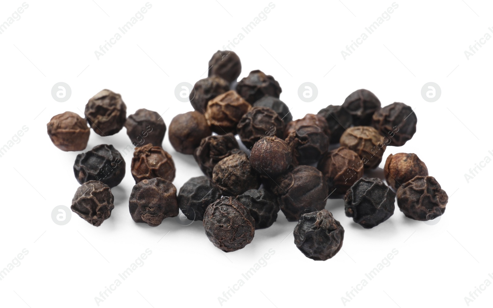 Photo of Aromatic spice. Many black dry peppercorns isolated on white