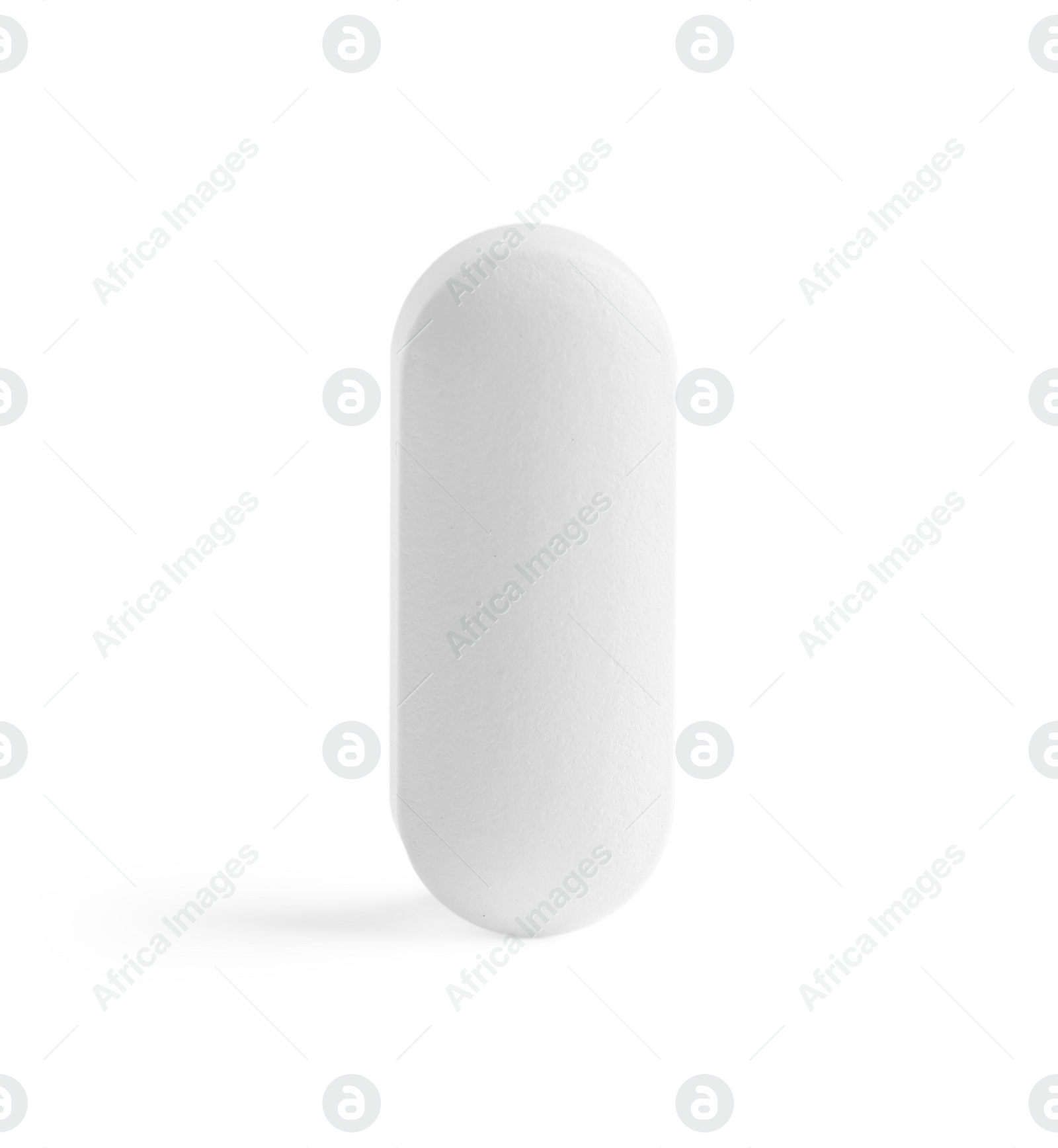 Photo of One pill on white background. Medicinal treatment